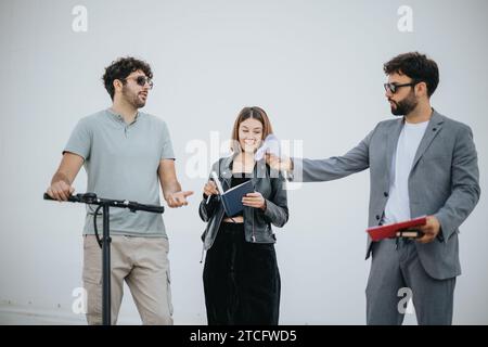 A diverse group collaborates, plans for business expansion, and discusses new opportunities in the urban city to achieve success and profitability. Stock Photo