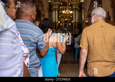 Salvador, Bahia, Brazil - August 12, 2022: Faithful pray during mass at Senhor do Bonfim Church in the city of Salvador, Bahia. Stock Photo