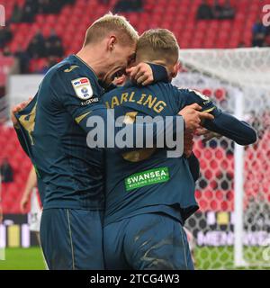 Swansea celebrates Harry Darling #6 of Swansea City goal, during the Sky Bet Championship match Stoke City vs Swansea City at Bet365 Stadium, Stoke-on-Trent, United Kingdom, 12th December 2023  (Photo by Craig Thomas/News Images) in Stoke-on-Trent, United Kingdom on 12/12/2023. (Photo by Craig Thomas/News Images/Sipa USA) Stock Photo