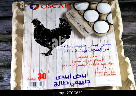 Cairo, Egypt, December 10 2023: Oscar white fresh and raw hen chicken organic eggs carton, stack of eggs to be cooked in various cuisines, no hormones Stock Photo