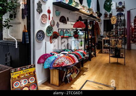 A shop in Seville Spain with colourful Artisanal Crafts Shop Interior selling a range of locally produced fans. and ceramics. Stock Photo
