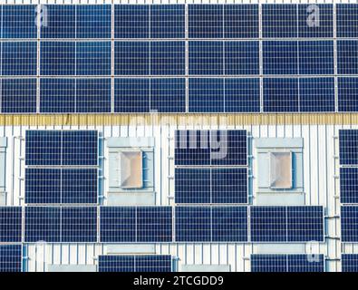 aerial view close up macro of solar panels in full sun on a roof Stock Photo