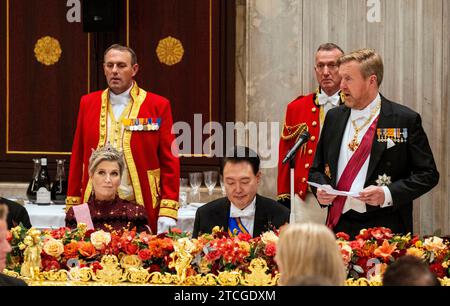 King Willem-Alexander and Queen Maxima of The Netherlands, President Yoon Suk Yeol at the Royal Palace in Amsterdam, on December 12, 2023, to attend the State-Banguet, on the 1st of a 2-day state visit from South Korea to The Netherlands Photo: Albert Nieboer/Netherlands OUT/Point de Vue OUT Stock Photo