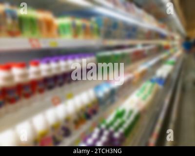 blur milk products bottles on refrigerator shelf in supermarket Stock Photo