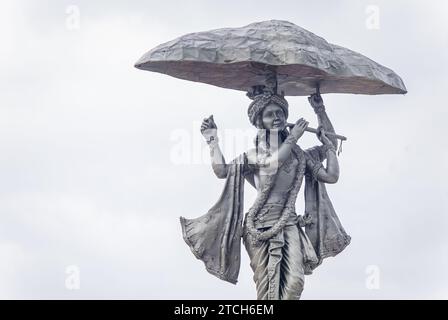 hindu god lord krishna isolated statue with bright background at morning from flat angle Stock Photo