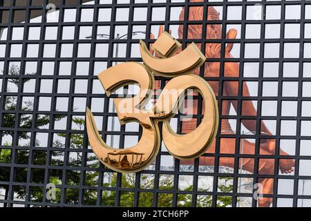 hindu holy religious symbol AUM or OM from unique perceptive at morning symbolizes the Universe and the ultimate reality image is taken at statue of b Stock Photo