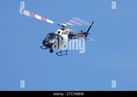 Los Angeles, California, USA - March 27, 2019: A helicopter from the Los Angeles Police Department's Aerial Support Division is shown in flight. Stock Photo