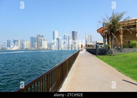 Walking along the Corniche in Sharjah, UAE. Stock Photo