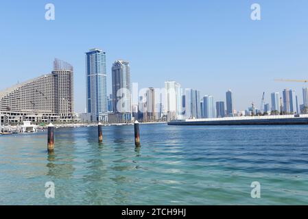 The modern skyline along the corniche of the Al Khan Lagoon  in Sharjah, UAE. Stock Photo