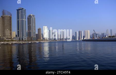 The modern skyline along the corniche of the Al Khan Lagoon  in Sharjah, UAE. Stock Photo