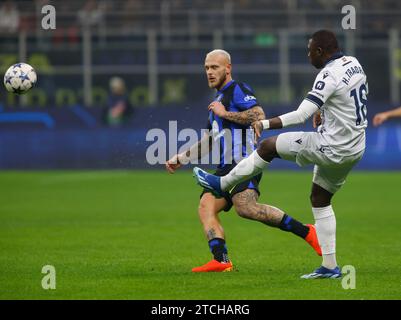 Milan, Italy. 12th Dec, 2023. Hamari Traore of Real Sociedad (R) and Federico Di Marco of Inter Milan (L) seen in action during the match between Inter FC and Real Sociedad de Futbol as part of the Champions League 2023/24, Group D football match at San Siro Stadium. Final score; Inter FC 0 - 0 Real Sociedad de Futbol (Photo by Nderim Kaceli/SOPA Images/Sipa USA) Credit: Sipa USA/Alamy Live News Stock Photo
