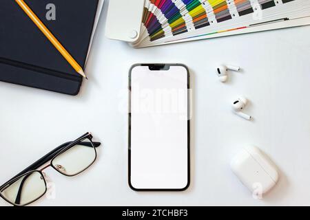 Graphic designer workplace, phone mock-up, top view Stock Photo