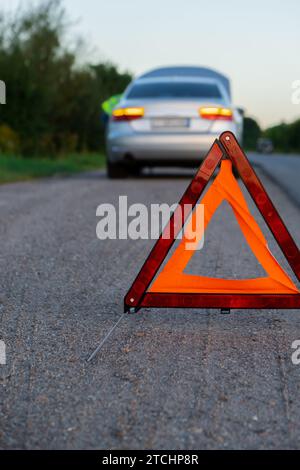 accident warning sign at the street for other cars Stock Photo - Alamy