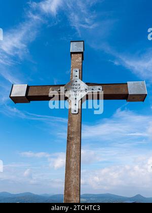 Christian cross with inscription, One bears the other's burden, Hochwald summit, Zittau Mountains, Saxony, Germany Stock Photo