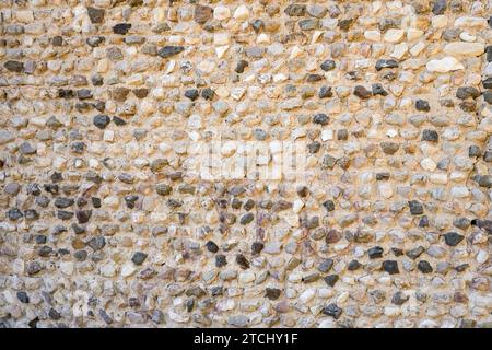 Historic old wall made of stones. Natural background. Stock Photo