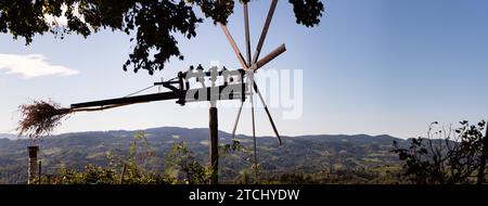 Styrian Tuscany like Vineyard with windmill, Landscape of grape crops durring sunset, Styria, Austria Stock Photo