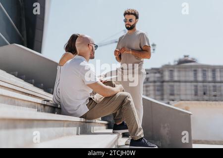 Business partners discussing data analysis and e-commerce strategies, targeting audience and ensuring online retail success. Stock Photo