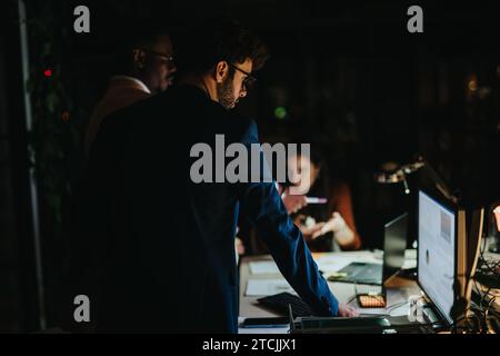 Collaboration and Creativity in a Multiracial Corporate Team During Late Working Hours. Catching Deadline Concept. Stock Photo