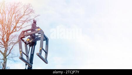 Dropside flatbed HIAB crane lorry with brick grab attachment deliver materials on construction site and offloading them Stock Photo