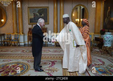 The Ambassador of Senegal, General Cheikh Wade, presents his credentials to King Charles III during a private audience at Buckingham Palace, London. Picture date: Wednesday December 13, 2023. Stock Photo