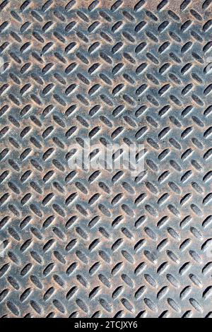 Old rusty diamond metal plate texture pattern used as abstract background Stock Photo