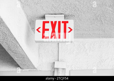 Exit sign on ceiling in the hotel Stock Photo