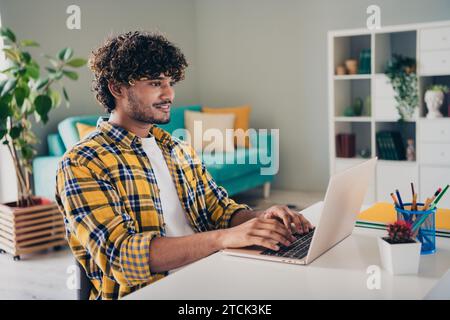 Photo of nice confident man operating system administrator browsing media creating programming website studying home workstation indoors Stock Photo