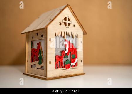 Santa and reindeer in a wooden cabin decoration Stock Photo