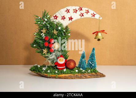 Christmas decoration moon with Santa and trees Stock Photo