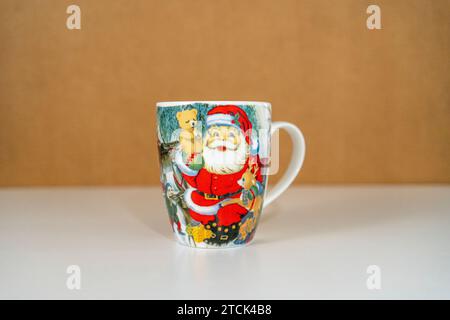 Christmas cup with Santa Claus and teddybear Stock Photo
