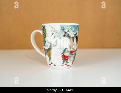 Christmas cup with reindeer and kid Stock Photo