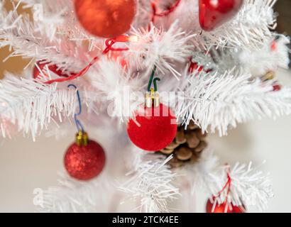 White Christmas tree with red decorations Stock Photo