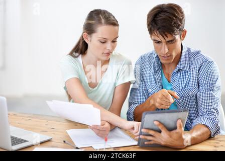 Admin, paperwork and business people with tablet, help and brainstorming in market research. Startup, man and women at desk with digital app in office Stock Photo