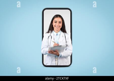 Smiling caucasian woman doctor using digital tablet on smartphone screen Stock Photo