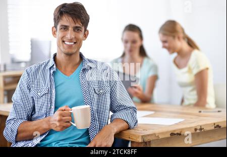 Businessman, drinking coffee and smile in portrait, employee and confidence for career and planning. Indian male person, teamwork and pride for Stock Photo