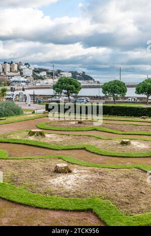 Torquay, UK. 13th Dec, 2023. Torbay council face criticism for cutting down the iconic palm trees from the seafront Italian Gardens. Tree stumps left. Credit: Thomas Faull/Alamy Live News Stock Photo