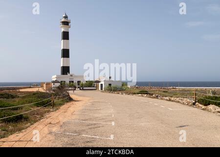 Cap d'Artrutx lighthouse near the town of Cala en Bosch in the southwest of the Spanish island of Menorca. Stock Photo