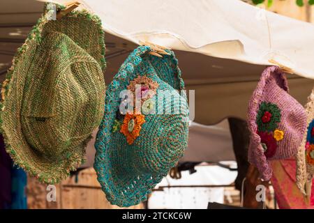 Spanish woven straw hats on a market stall. Stock Photo