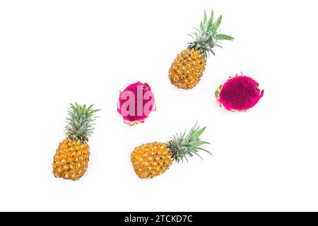 Tropical fruit: pineapple and dragon fruits on white background. Flat lay Stock Photo