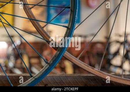 Closeup image of  two old bicycle rims, wheels, used to accent a pub, bar, decor. Stock Photo