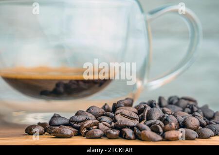Coffee beens and a glass cup with coffee Stock Photo