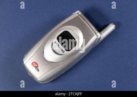 vintage silver samsung Virgin branded flip phone isolated on white studio background Stock Photo