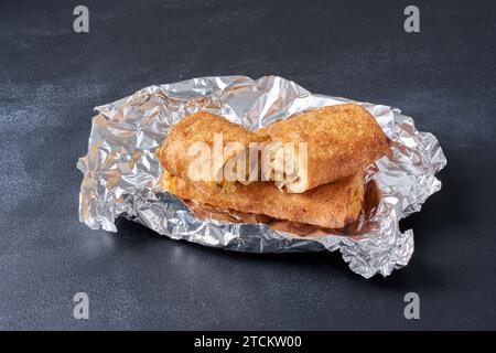 Hot fried spring rolls on a darker background Stock Photo