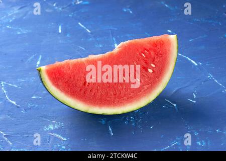 red juicy watermelon on a blue background Stock Photo