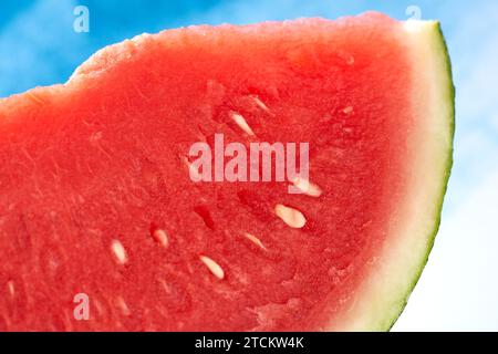 red juicy watermelon on a blue background Stock Photo