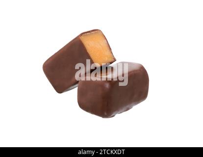 Candy chocolates with lemon filling isolated on white. Stock Photo