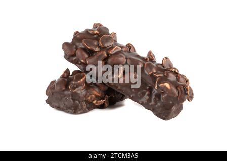 Two bars of brownies covered with nuts and filled with chocolate on a white background. Copy space. Stock Photo