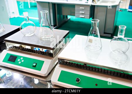 Laboratory heating plates and flasks Stock Photo