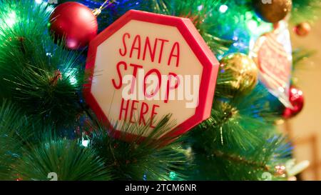 Santa stop here sign on decorated Christmas tree. Copy space. High quality photo Stock Photo