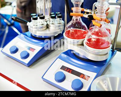 Laboratory heating blocks with interchangeable inserts for flasks Stock Photo